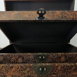 Set of two elegant bronze leather decorative storage boxes with embossed rose patterns, stacked for display in a vintage style interior