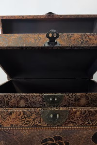 Set of two elegant bronze leather decorative storage boxes with embossed rose patterns, stacked for display in a vintage style interior