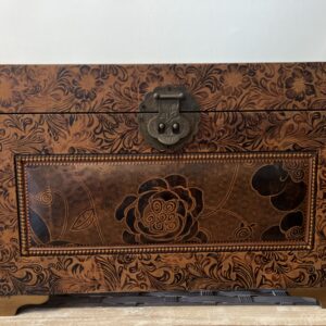 Set of two elegant bronze leather decorative storage boxes with embossed rose patterns, stacked for display in a vintage style interior