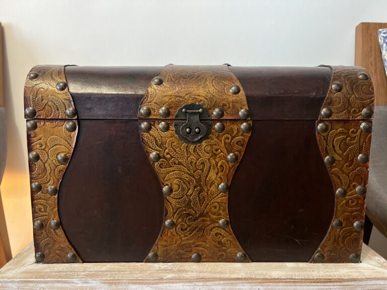 Vintage Indian storage chest made of wood with a bleached white hand-painted finish and woven rattan-style panels on the exterior