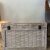 Vintage Indian storage chest made of wood with a bleached white hand-painted finish and woven rattan-style panels on the exterior