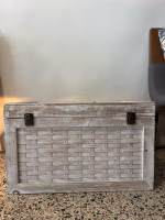 Vintage Indian storage chest made of wood with a bleached white hand-painted finish and woven rattan-style panels on the exterior