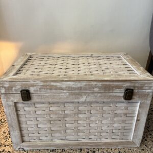 Vintage Indian storage chest made of wood with a bleached white hand-painted finish and woven rattan-style panels on the exterior