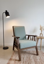 1950s style solid walnut armchair with straight-lined frame and light green upholstery, newly restored and professionally upholstered
