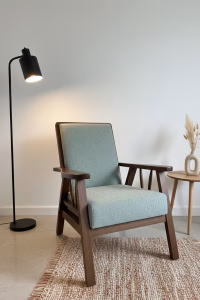 1950s style solid walnut armchair with straight-lined frame and light green upholstery, newly restored and professionally upholstered