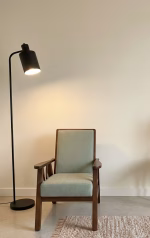 1950s style solid walnut armchair with straight-lined frame and light green upholstery, newly restored and professionally upholstered
