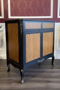 Vintage Regency-style accent cabinet with black lacquered finish and intricate geometric wood inlay marquetry, 90cm wide luxury storage chest