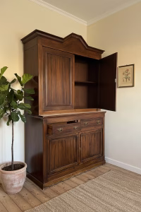 Large authentic French vintage Buffet Deux-Corps in solid wood with a rustic patinated finish, featuring a top display cabinet and antique brass drawer pulls