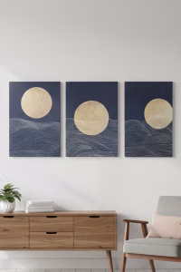 Set of three abstract canvas prints featuring a gold moon and geometric waves in navy and black, displayed as a triptych wall art set over a sofa