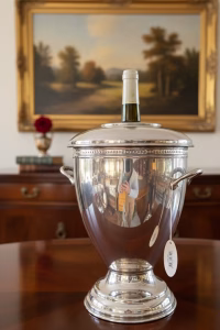 Baroque brand silver-plated champagne ice bucket with mirrored finish and professional sommelier lid on a luxury dining table