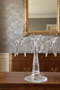 Triple-arm Bohemian lead crystal candelabra with hanging teardrop prisms, made in Czech Republic, styled on a formal dining table