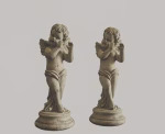 Pair of classical cherub statues with a distressed weathered stone finish, standing on circular plinths, styled on a white mantelpiece