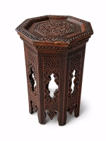Hand-carved Damascus style miniature accent table featuring an octagonal top with geometric relief and an arched fretwork base from RockFort Lebanon.