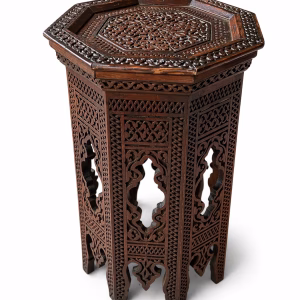 Hand-carved Damascus style miniature accent table featuring an octagonal top with geometric relief and an arched fretwork base from RockFort Lebanon.
