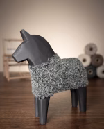 Modern minimalist wooden horse sculpture with a matte black finish and a hand-knitted textured wool coat from RockFort decor boutique in Lebanon.