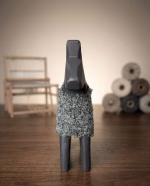 Modern minimalist wooden horse sculpture with a matte black finish and a hand-knitted textured wool coat from RockFort decor boutique in Lebanon.