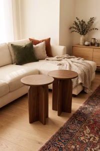 Handmade solid walnut side table featuring a smooth round top and a unique sculptural architectural base from RockFort design store in Lebanon.