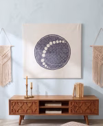 Large hand-embroidered textile wall hanging featuring a navy blue circular mandala and moon-phase design on a white fabric base from RockFort boutique in Lebanon.
