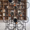 Mid-century modern geometric wine rack crafted from matte black metal with a 15-bottle capacity grid display from RockFort furniture store in Lebanon.