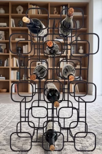Mid-century modern geometric wine rack crafted from matte black metal with a 15-bottle capacity grid display from RockFort furniture store in Lebanon.