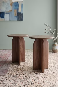 Handmade solid walnut side table featuring a smooth round top and a unique sculptural architectural base from RockFort design store in Lebanon.
