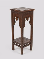 Two-tier hand-carved Damascus style pedestal table featuring a dark patina wood finish, square top, and detailed geometric relief carvings from RockFort Lebanon.