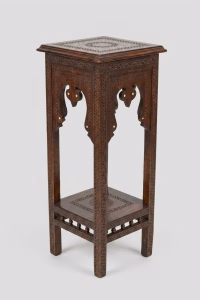 Two-tier hand-carved Damascus style pedestal table featuring a dark patina wood finish, square top, and detailed geometric relief carvings from RockFort Lebanon.