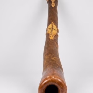 Authentic handcrafted Aboriginal didgeridoo signed by Tulklana Kumbi with intricate traditional carvings and wood-burned animal motifs from RockFort Lebanon