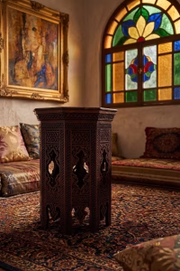 Hand-carved Damascus style miniature accent table featuring an octagonal top with geometric relief and an arched fretwork base from RockFort Lebanon.