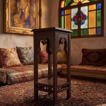 Two-tier hand-carved Damascus style pedestal table featuring a dark patina wood finish, square top, and detailed geometric relief carvings from RockFort Lebanon.