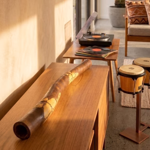 Authentic handcrafted Aboriginal didgeridoo signed by Tulklana Kumbi with intricate traditional carvings and wood-burned animal motifs from RockFort Lebanon