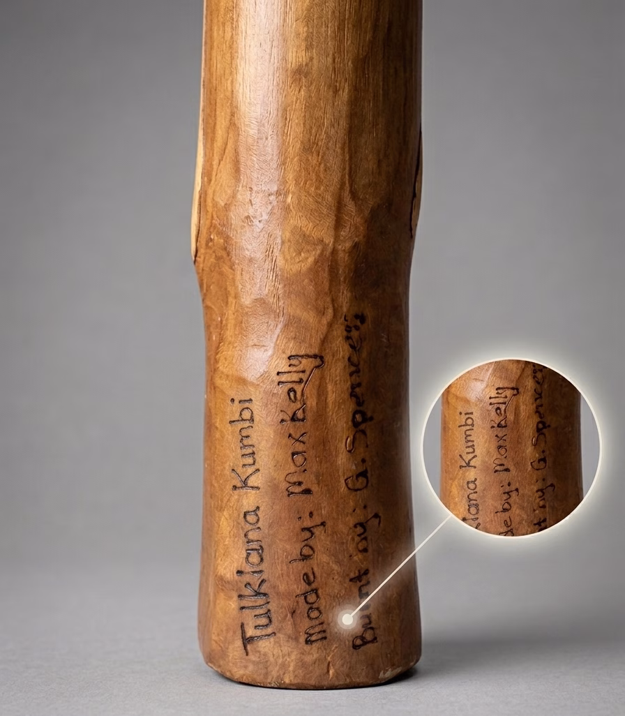 Authentic handcrafted Aboriginal didgeridoo signed by Tulklana Kumbi with intricate traditional carvings and wood-burned animal motifs from RockFort Lebanon