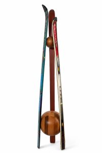Sustainable repurposed ski coat hanger standing on a handcrafted solid wood base with a matching wooden top joint from RockFort boutique in Lebanon.