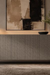 Modern linear ribbed sideboard in light charcoal grey featuring a vertical fluted exterior and matte black solid wood legs from RockFort Lebanon.
