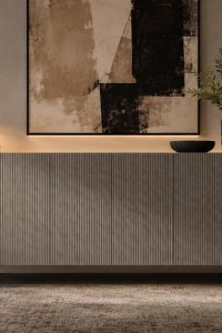 Modern linear ribbed sideboard in light charcoal grey featuring a vertical fluted exterior and matte black solid wood legs from RockFort Lebanon.