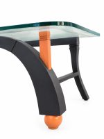 Close-up of the salmon orange stacked corner joint and spherical foot under the 1 cm glass top of the designer coffee table from RockFort Lebanon.