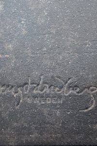 Close-up of the Bengt Lindberg Sweden signature embossed on the black steel base of the Wild Horse Candelabra from RockFort Lebanon.