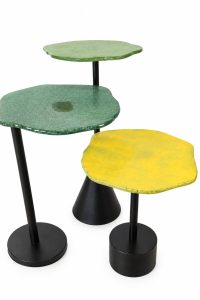 Set of three modern designer cocktail tables with organic light green, dark green and yellow textured glass tops on black steel bases from RockFort Lebanon.