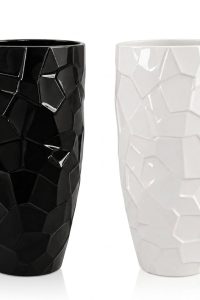 Pair of tall geometric ceramic floor vases in glossy black and glossy white with a faceted crystal pattern from RockFort Lebanon.